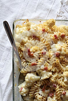 Baked pasta with cauliflower, bacon and parmesan cheese.