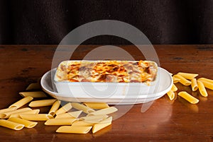 Baked penne pasta with tomato sauce and cheese