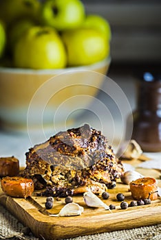 Baked pork ham with spices on a wooden Board