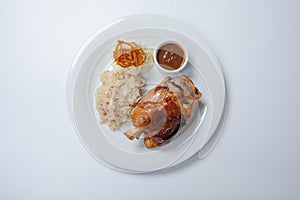 Baked pork knuckle served with braised cabbage