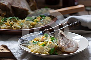 Baked pork knuckle served with stewed cabbage and beer. Rustic style