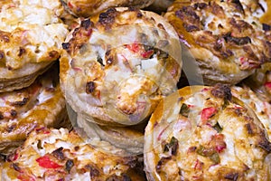 Baked portioned tartlets made from puff pastry with crab cheese