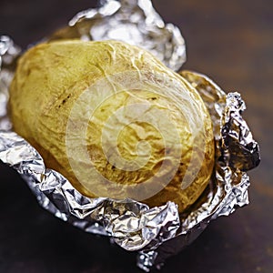 Baked potato in aluminium foil