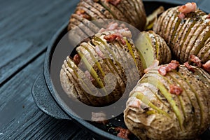 Baked potato with bacon and spices