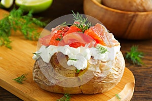 Baked potato with cream of the cream cheese and salted salmon,