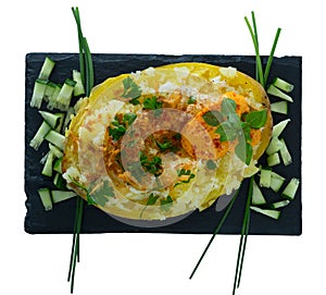 Baked potato with herbs, egg and cucumbers