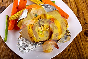 Baked potato with shrimps