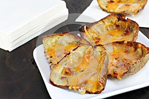 Baked potato skins and cheese photo