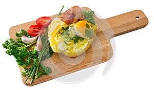 Baked potato stuffed with herbs, egg, bacon