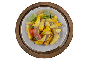 Baked potato with vegetables on a wooden tray. Rustic potato slices decorated with cherry tomatoes and greens. plate of potatoes