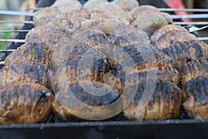 baked potatoes on the coals on the grill with a Golden crust. food preparation