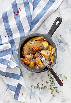 Baked potatoes with garlic and fresh thyme.