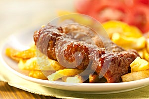 Baked potatoes and grilled meat