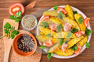 Baked potatoes in a peel with tomatoes, herbs, spices and sesame