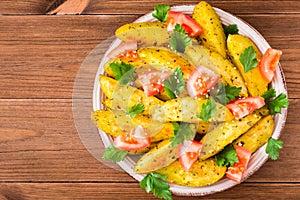 Baked potatoes in a peel with tomatoes, herbs, spices and sesame