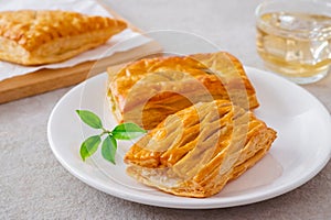 Baked puff pastry on white plate