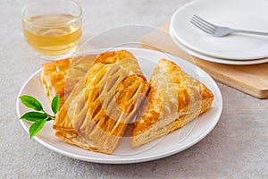 Baked puff pastry on white plate