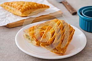 Baked puff pastry on white plate