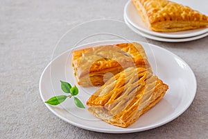 Baked puff pastry on white plate