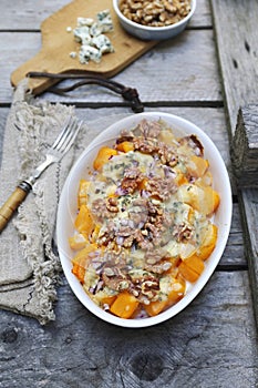 Baked pumpkin with blue cheese and walnuts, gratin