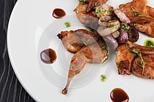 Baked quails with vegetable