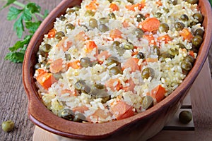 Baked rice with peas and sliced carrot