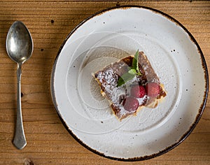Baked rice pudding with raspberry