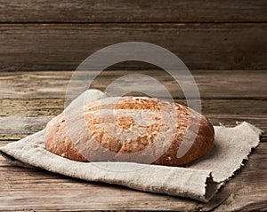 Baked round rye flour bread
