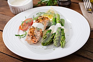Baked salmon garnished with asparagus