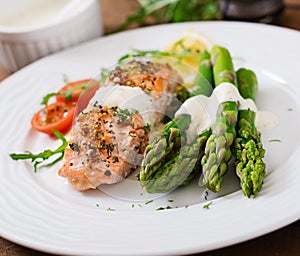 Baked salmon garnished with asparagus