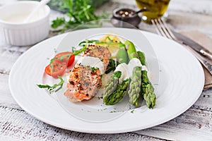 Baked salmon garnished with asparagus