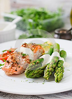 Baked salmon garnished with asparagus