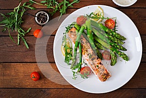 Baked salmon garnished with asparagus