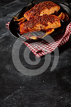 Baked salmon in pan with copy space