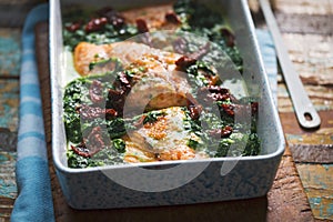 Baked salmon with spinach and sun dried tomatoes