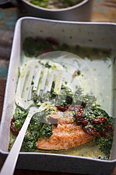 Baked salmon with spinach and sun dried tomatoes