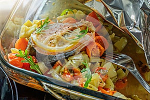 Baked salmon with vegetables in foil