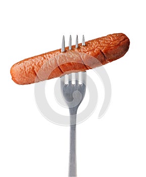 Baked sausage on a fork isolated