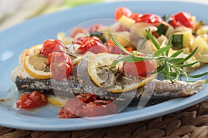 Baked sea bass with vegetables