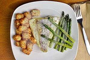baked season cod with asparagus and tater tots