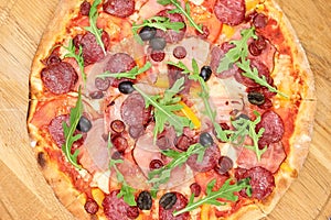 Baked sliced salami pizza, top view. photo