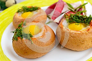 Baked small flavorful bun with bacon, cheese, quail egg and greens