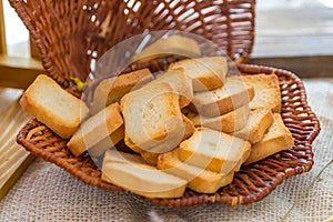 Baked small slices of bread in a basket
