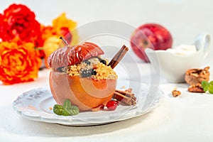 Baked spicy apple with couscous and dried berries