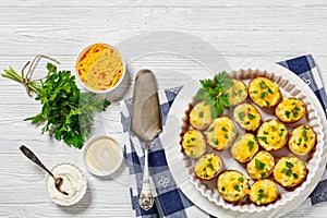 baked stuffed red potato on white baking dish