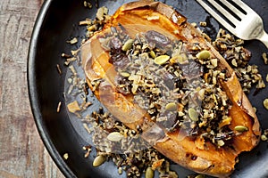 Baked Sweet Potato Stuffed With Wild Rice Seeds and Cranberries