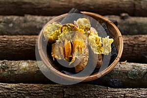 Baked sweet potato on wooden background