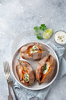 Baked sweet potato with yogurt sause and chives