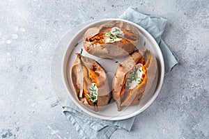 Baked sweet potato with yogurt sause and chives