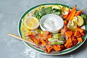 Baked sweet potato, zucchini and carrots